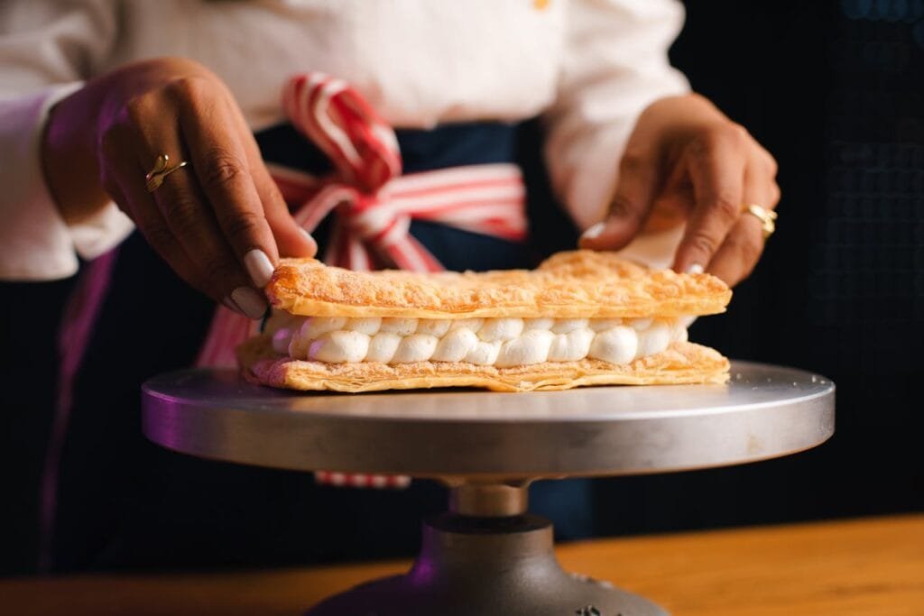 Baker Assembling a Dessert